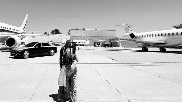 Kylie and Travis with both their planes. Picture: Instagram