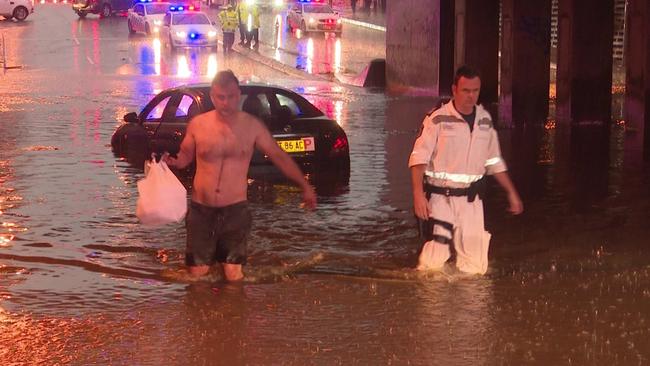 A man is rescued from his P-plated car on Woodville Rd, Granville. Picture: TNV