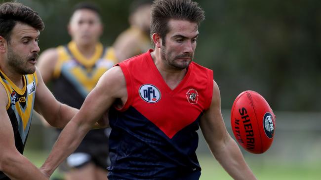 Diamond Creek’s Lachlan Brannelly keeps his eye on the ball.