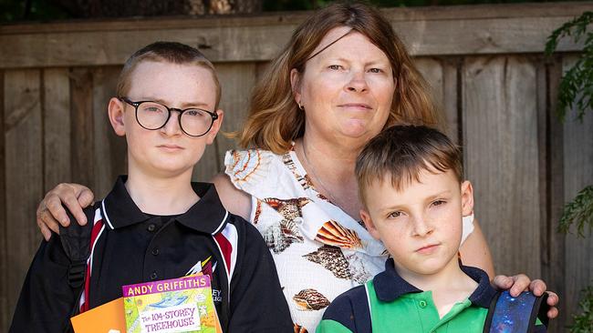 MELBOURNE, JANUARY 16, 2024: Melbourne is AustraliaÃs most expensive city for a public education. Frankston North mother Kylie Davis with Max (glasses), 12, and Jacob (green top), 9. Picture: Mark Stewart