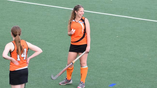 An Orange player laughs at NSW U18s Girls Hockey Championships, May 21.
