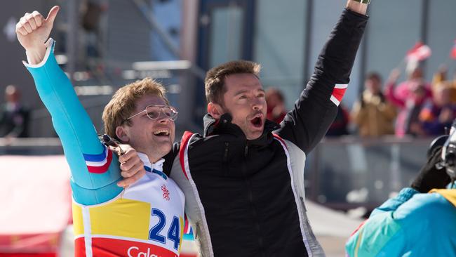 Taron Egerton as Michael Edwards and Hugh Jackman as Bronson Peary in a scene from the new film<i/>Eddie the Eagle.