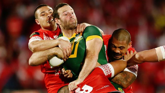 Kangaroos captain Boyd Cordner is wrapped up by the Tonga defence. Picture: Getty Images