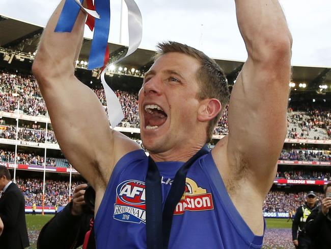 2016 AFL Grand Final match between the Western Bulldogs and the Sydney Swans at the Melbourne Cricket Ground (MCG), Melbourne, Australia on October 1, 2016.  Western Bulldogs Dale Morris celebrates with the Premiership Cup  Picture: David Caird