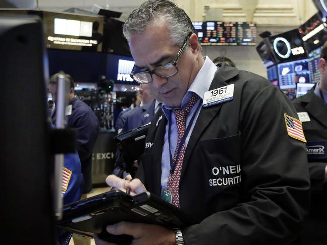 Trader Kenneth Polcari works on the floor of the New York Stock Exchange, Wednesday, Dec. 16, 2015. Stocks are opening higher, led by gains in banking shares ahead of an interest rate decision by the Federal Reserve. (AP Photo/Richard Drew)