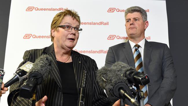 Former Queensland Rail CEO Helen Gluer with Queensland Minister for Transport Stirling Hinchliffe. Picture: AAP Image/Dave Hunt