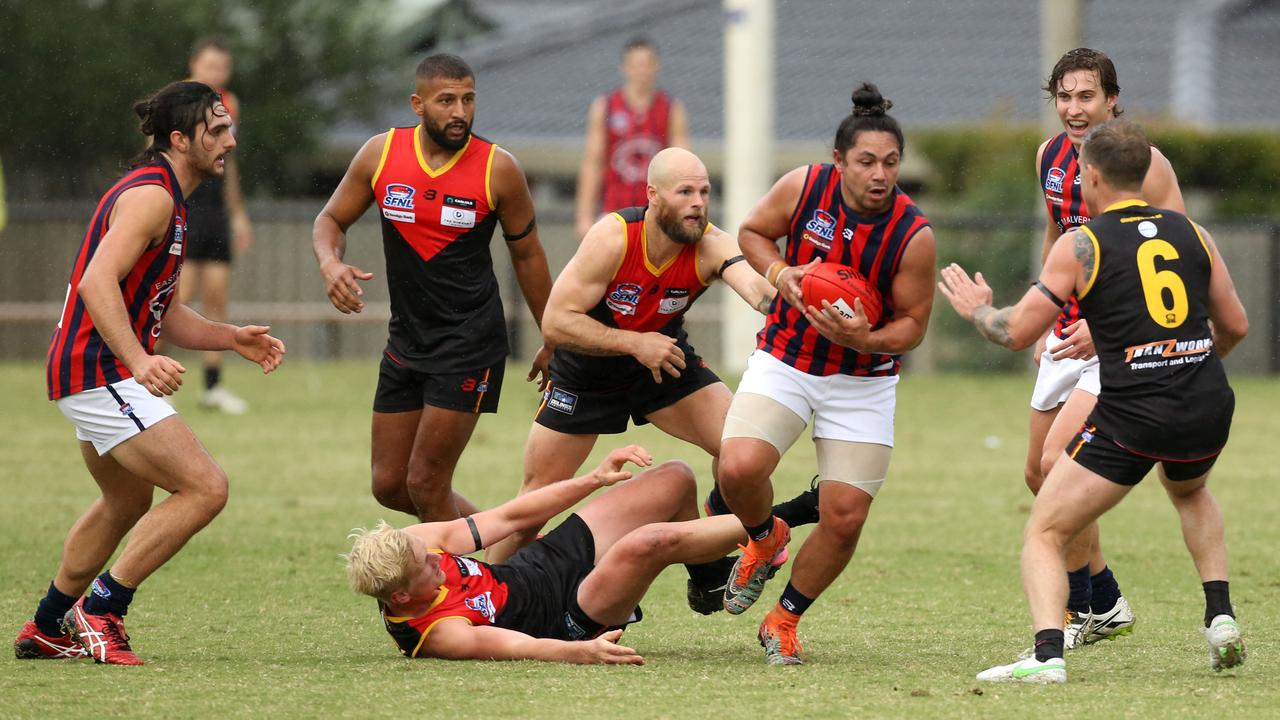 Southern: East Malvern’s David Ismail escapes the tackle against Dingley. Picture: Stuart Milligan