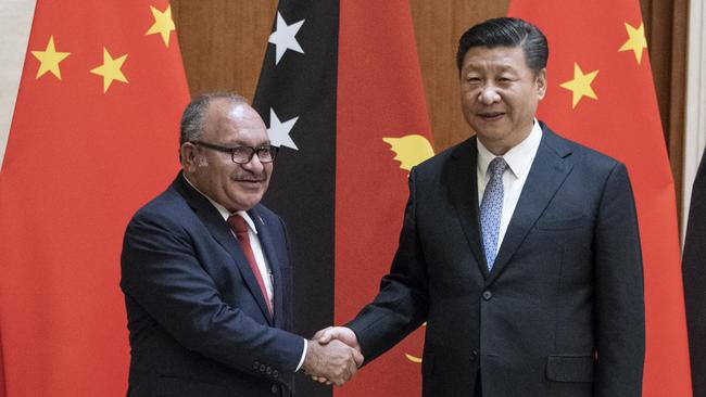 China’s President Xi Jinping greets PNG’s Prime Minister Peter O'Neill during the latter’s visit to Beijing in June. Picture: Getty Images.