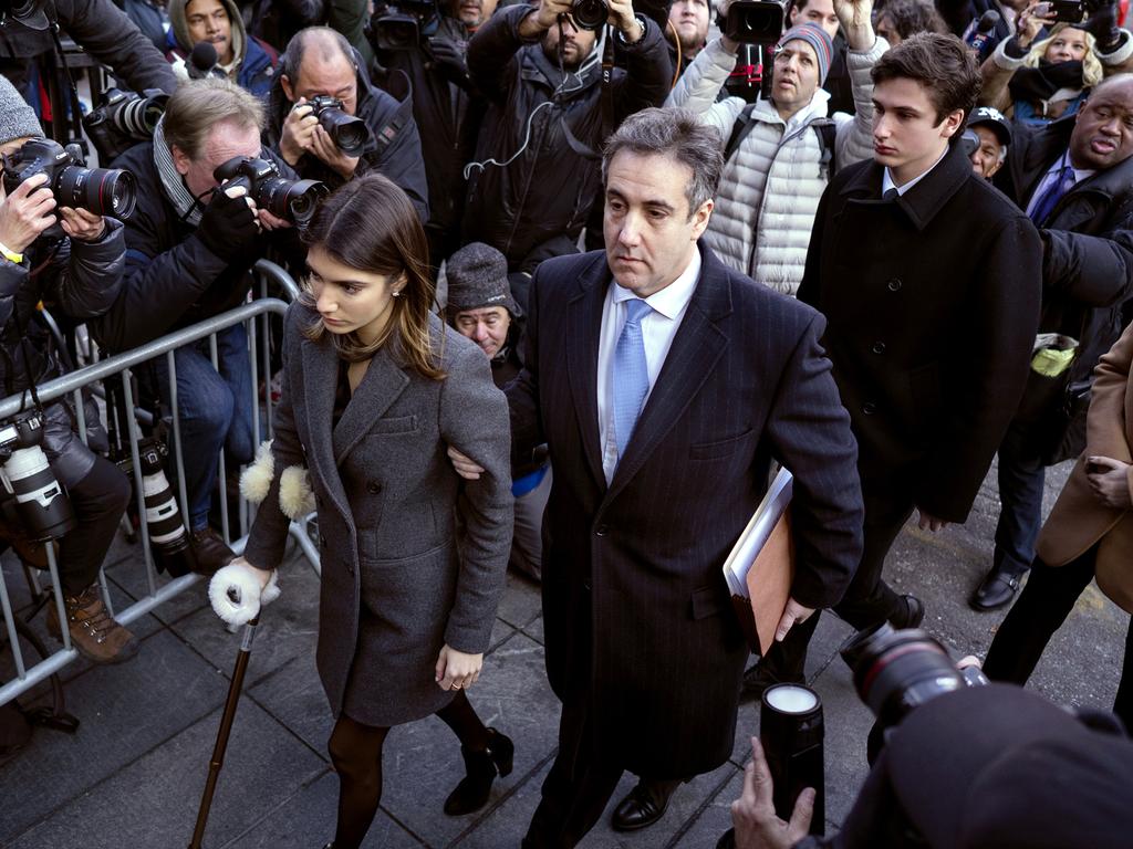 Michael Cohen, accompanied by his children, arrives at federal court for his sentencing in New York. Picture: AP 