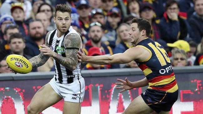 Jamie Elliott takes on Luke Brown at Adelaide Oval. Picture: Sarah Reed