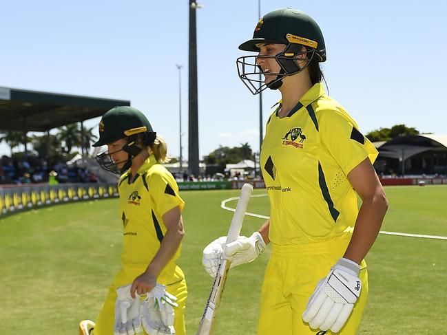 MACKAY, AUSTRALIA - SEPTEMBER 26: Australian batters Nicola Carey and Stella Campbell walk off the field at the end of the first inning during game three of the Women's One Day International series between Australia and India at Great Barrier Reef Arena on September 26, 2021 in Mackay, Australia. (Photo by Albert Perez/Getty Images)