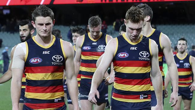 Matt Crouch and Tom Lynch leave Adelaide Oval after Saturday night’s loss to Melbourne. Picture: Sarah Reed