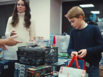 Prince George looked all grown up as helped pack bags of presents. Picture: Kensington Palace/YouTube