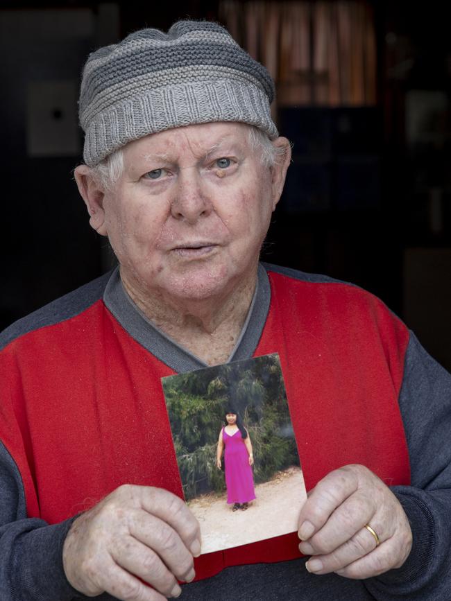 Zenaida’s husband Michael seen clutching the photograph of his wife Zenaida, who has drowned. Picture: Brett Hartwig