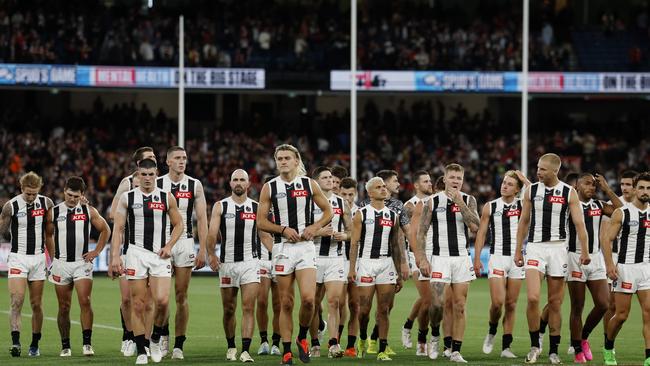 MELBOURNE , AUSTRALIA. March 21 , 2024.  St Kilda vs Collingwood  at MCG. .   Darcy Moore leads the Magpies off the MCG after losing to St Kilda  . Pic: Michael Klein