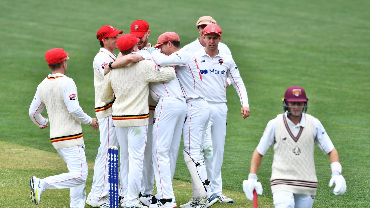 The Redbacks celebrate Brendan Doggett’s dismissal of Queenslander Marnus Labuschagne at Adelaide Oval. Picture: Mark Brake/Getty Images