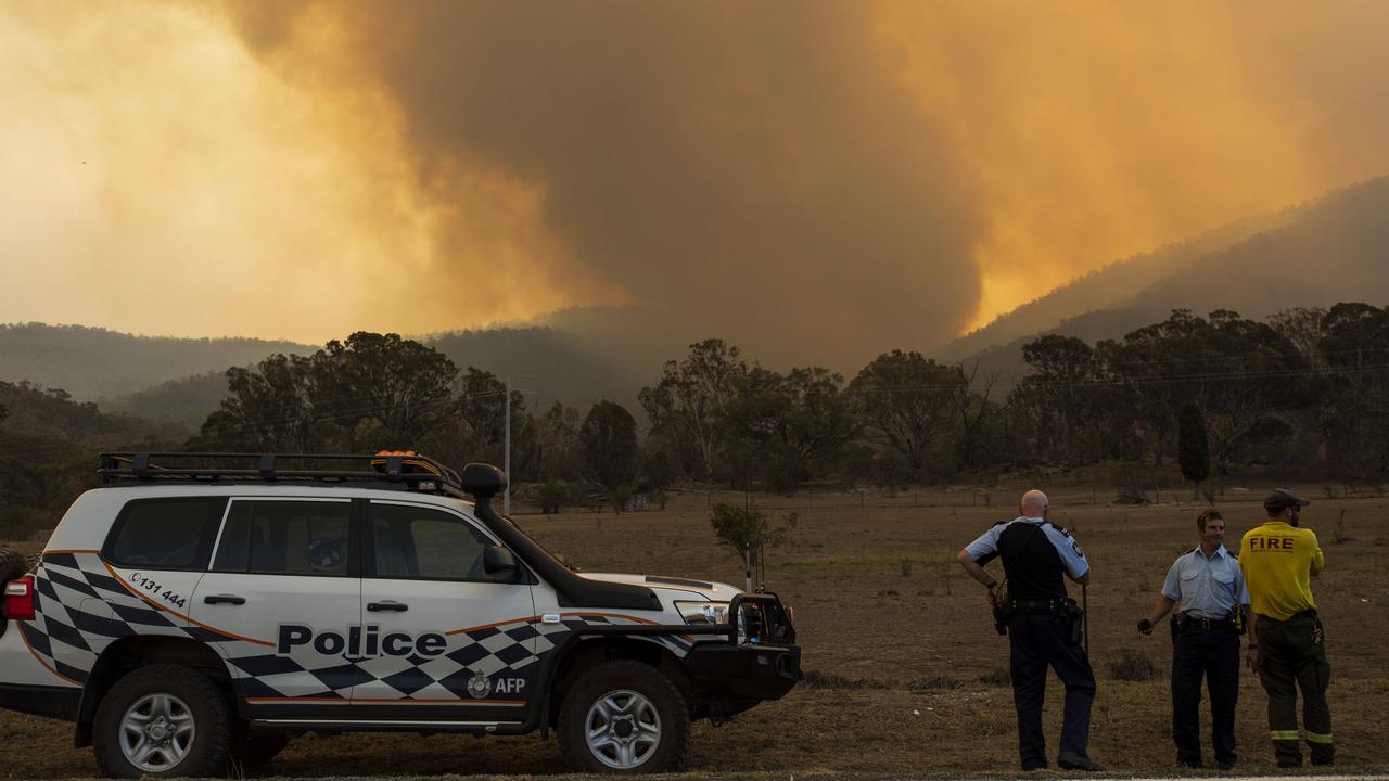 Police on Boboyan Road, south of Tharwa, ACT, as the Orroral fire in the Namadgi National Park escalates. Picture: Sean Davey