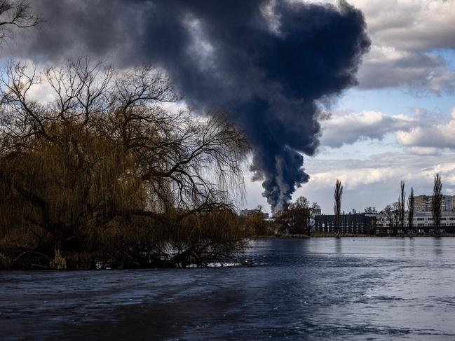 Smoke billows over the town of Vasylkiv just outside Kyiv after Russian strikes hit an oil depot. Picture: AFP