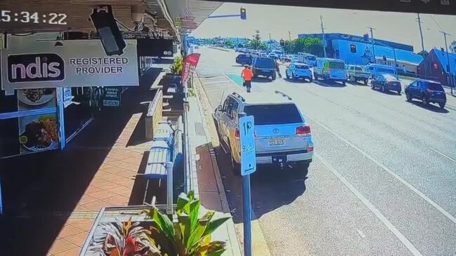 Scooter rider narrowly avoids disaster while rolling through busy intersection