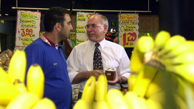 Cost of living was a big issue when Prime Minister John Howard met fruiterer Robert Guardala at Toowong shopping centre in Queensland. Picture: AAP Image/Dave Hunt