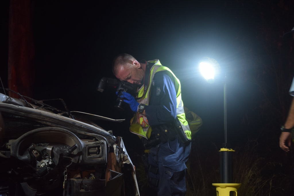 CHRISTMAS TRAGEDY: Police investigate the wreck after a crash that killed three men on Birthamba Rd, Bucca, on Saturday, December 17 2016. Picture: Eliza Goetze