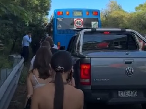 Commuters forced to walk along a major roadway after a serious crash on the Spit Bridge. Picture: Supplied