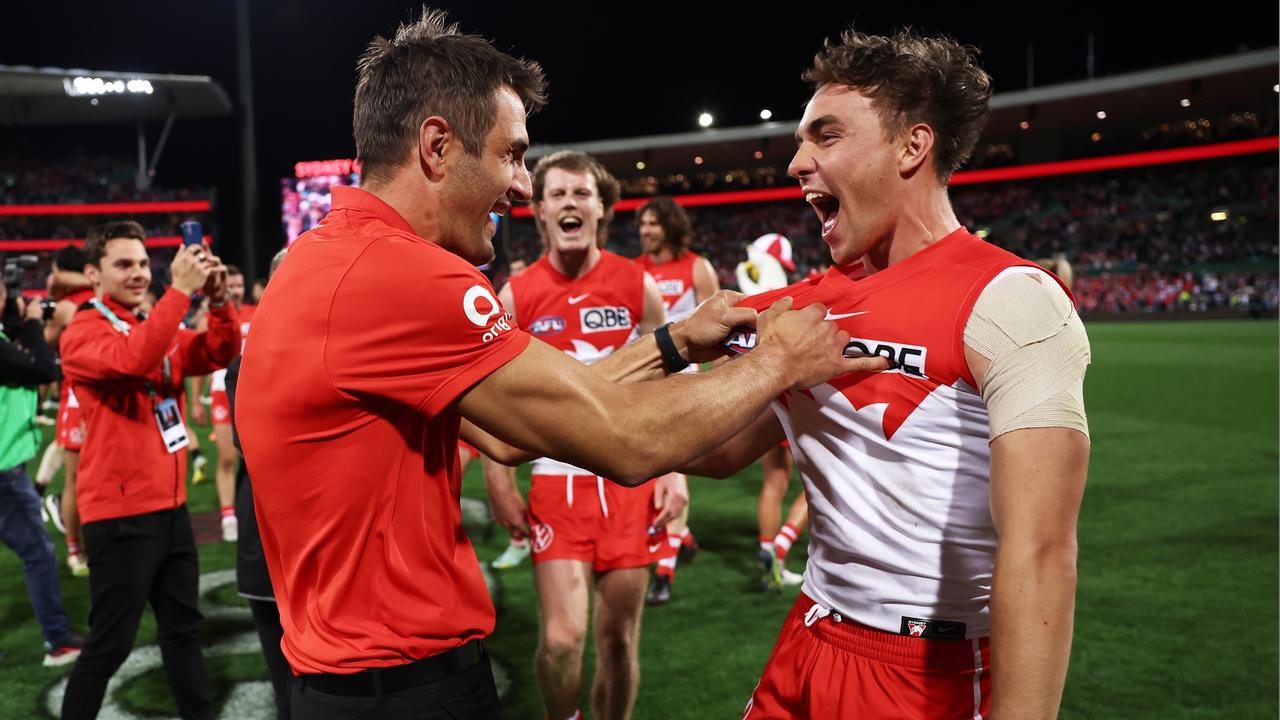 Ryan Clarke, pictured right celebrating Sydney’s preliminary final victory with retired teammate Josh Kennedy, has re-signed at the Swabs. Picture: Getty Images