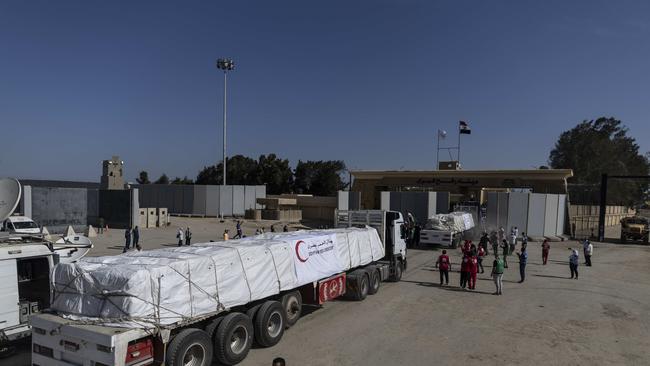 Aid convoy trucks cross the Rafah border from the Egyptian side. Picture: Getty