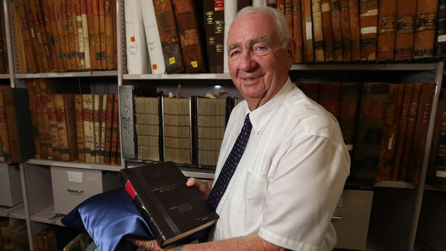 ***THIS IS STRICTLY EMBARGOED UNTIL JANUARY 1, 2019***Former Qld Premier Mike Ahern with the original Fitzgerald Report at Qld State Archives.December 20th, 2018. (AAP Image/Richard Waugh).