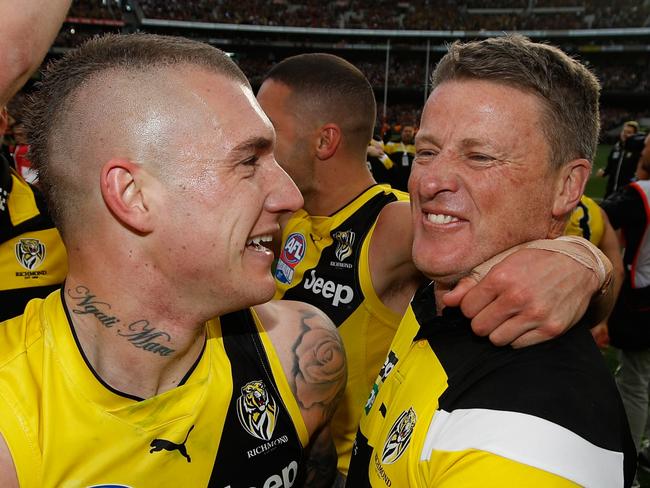 MELBOURNE, AUSTRALIA - SEPTEMBER 30: Dustin Martin of the Tigers and Damien Hardwick, Senior Coach of the Tigers celebrate during the 2017 Toyota AFL Grand Final match between the Adelaide Crows and the Richmond Tigers at the Melbourne Cricket Ground on September 30, 2017 in Melbourne, Australia. (Photo by Michael Willson/AFL Media/Getty Images)