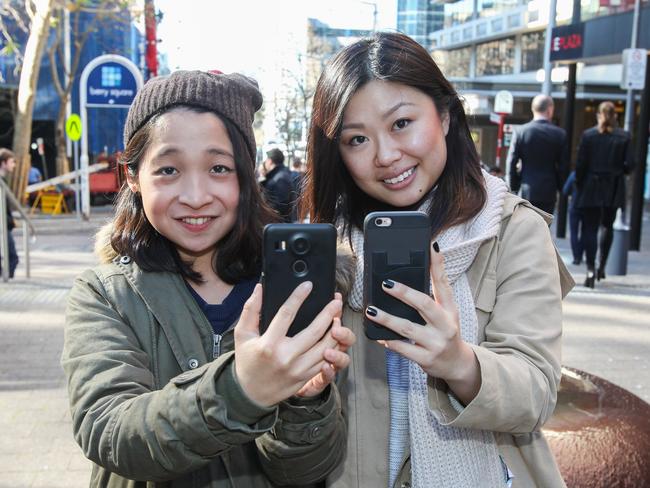 Elle and Cindy playing Pokemon Go in North Sydney. Picture: Jess Husband.