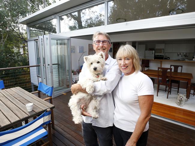 Sheridan Van Asch and David Burnett with Charlie, at their home in Woolloongabba, AAP/Josh Woning