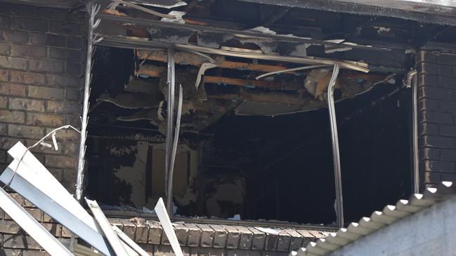 The burnt interior of the upper floor could be seen through the windows following the fire at Cromwell St.