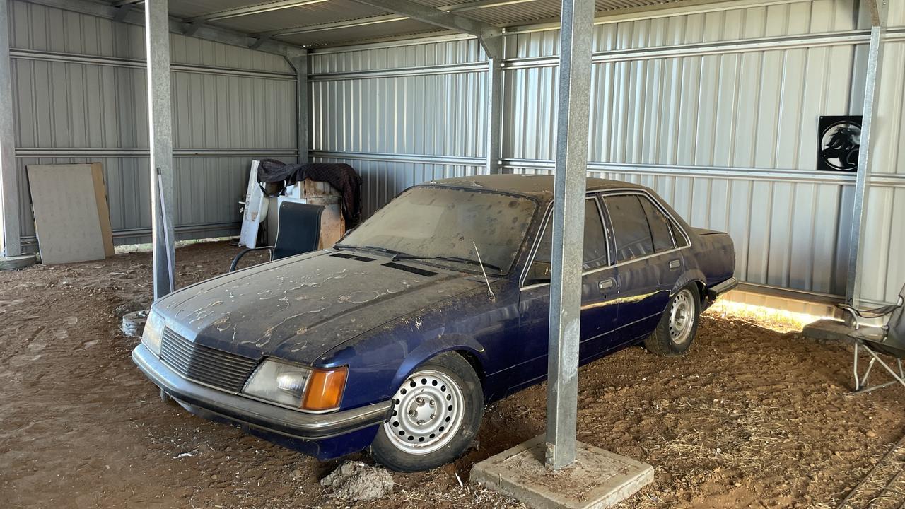 Rachelle's Holden Commodore sits in a shed in regional NSW. Picture: Jeff Darmanin