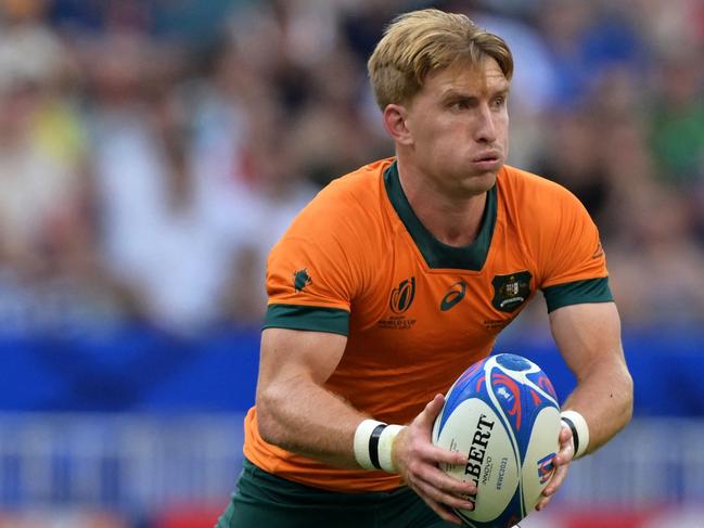 Australia's scrum-half Tate McDermott runs with the ball during the France 2023 Rugby World Cup Pool C match between Australia and Georgia at Stade de France in Saint-Denis, on the outskirts of Paris, on September 9, 2023. (Photo by Miguel MEDINA / AFP)