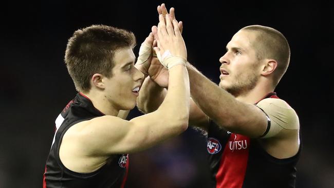 Things are looking up at Essendon for Zach Merrett and David Zaharakis.