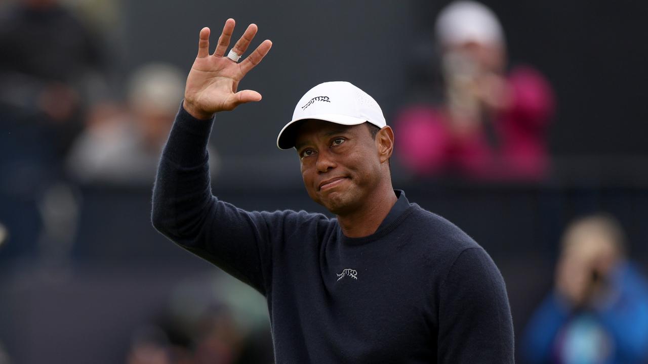 *** BESTPIX *** TROON, SCOTLAND – JULY 19: Tiger Woods of the United States acknowledges the crowd as he walks off the 18th green after finishing his round during day two of The 152nd Open championship at Royal Troon on July 19, 2024 in Troon, Scotland. (Photo by Harry How/Getty Images)