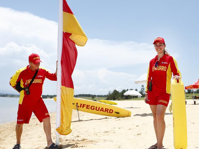 DAILY TELEGRAPH DECEMBER 6, 2024. Surf Life Saving NSW lifeguards Michael Studden and Kate Jeffries putting up the flags at Penrith Beach in Castlereagh where they will be on patrol this summer when the beach opens from tomorrow. Picture: Jonathan Ng