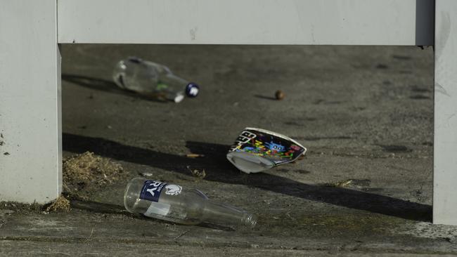 Bottles and rubbish strewn at the scene on Thursday morning. Picture: Tony Gough