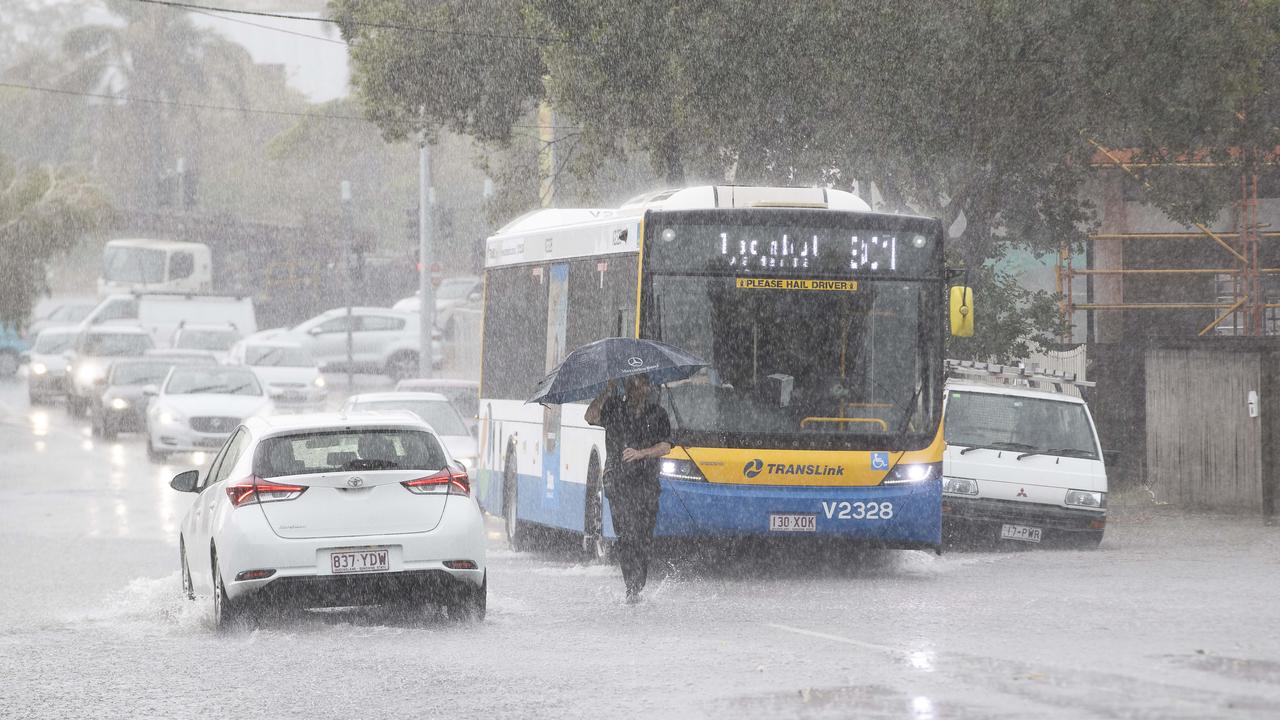 Streets are flooding around Brisbane as storm hits the city on Friday afternoon. Crosby Rd, Hamilton, Brisbane, 13th of December 2019. (AAP Image/Attila Csaszar)