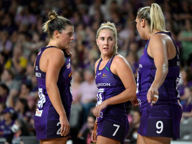 BRISBANE, AUSTRALIA - MARCH 19: Donnell Wallam of the Firebirds speaks with Lara Dunkley and Mia Stower of the Firebirds during the round one Super Netball match between Queensland Firebirds and Adelaide Thunderbirds at Nissan Arena, on March 19, 2023, in Brisbane, Australia. (Photo by Matt Roberts/Getty Images)