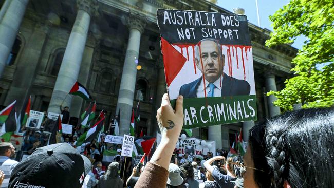 A protester holds an anti Benjamin Netanyahu sign during the Rally for Palestine on the steps Of Parliament House on Sunday, November 5. Picture: Mark Brake