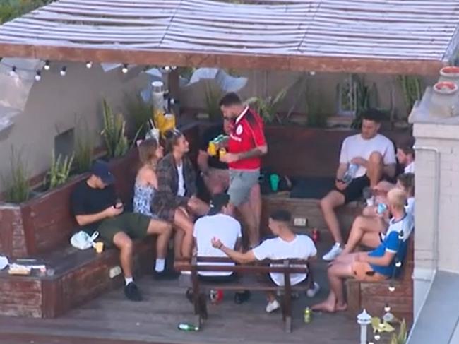 Backpackers having a rooftop party in Kings Cross were dobbed in. Picture: Seven News