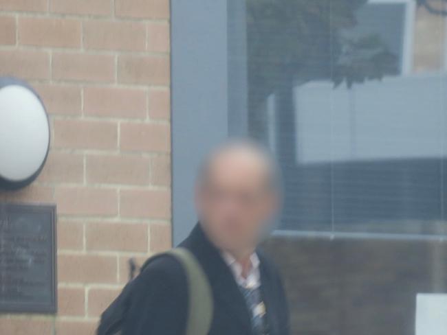 The man, aged in his 30s, leaving Wyong Local Court last month after pleading guilty to filming his stepdaughter in the shower. Picture: NewsLocal