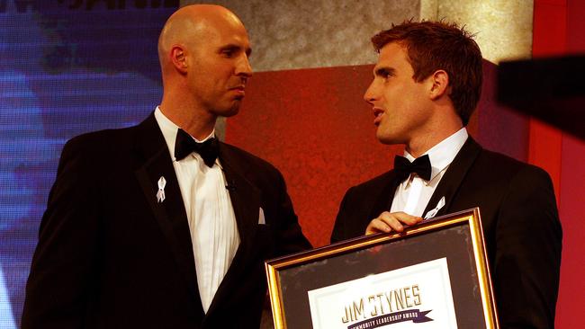 Daniel Jackson, right, receiving the inaugural Jim Stynes Community Leadership Award from Melbourne great Jim Stynes in 2012.