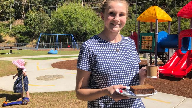 Rivulet Cafe barista and cafe manager Charlotte Smith serves a babycino and banana bread in the outdoor play area. Picture: PATRICK GEE