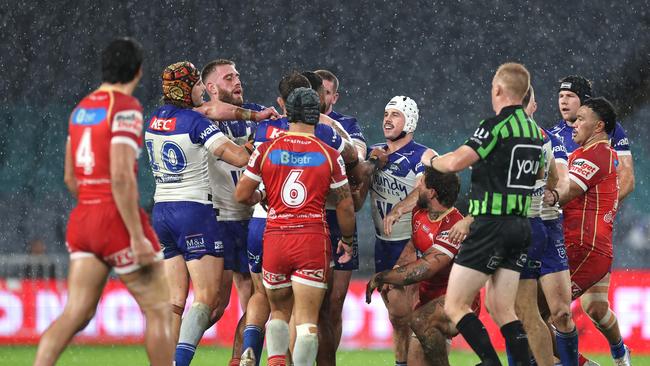 Samuel Hughes and Reed Mahoney of the Bulldogs scuffle with Francis Molo of the Dolphins. Picture: Getty Images