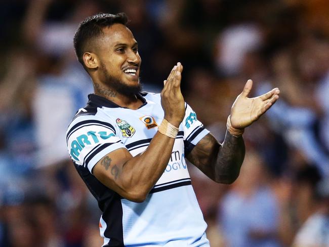 Ben Barba of the Sharks celebrates scoring a try against the Tigers.