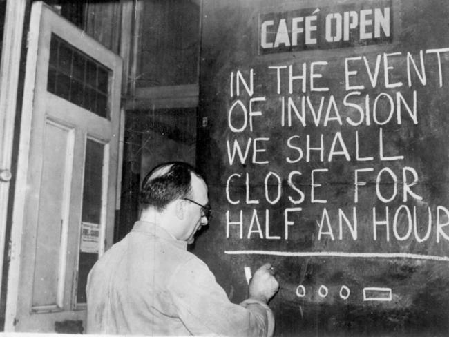 A British cafe owner maintains the British sense of humour during the terror of the London blitz. Picture: Supplied