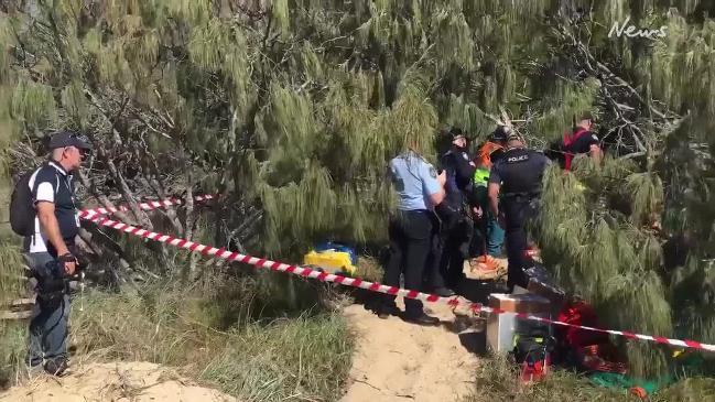 Man buried in sand at Hervey Bay (Ashleigh Dwan)